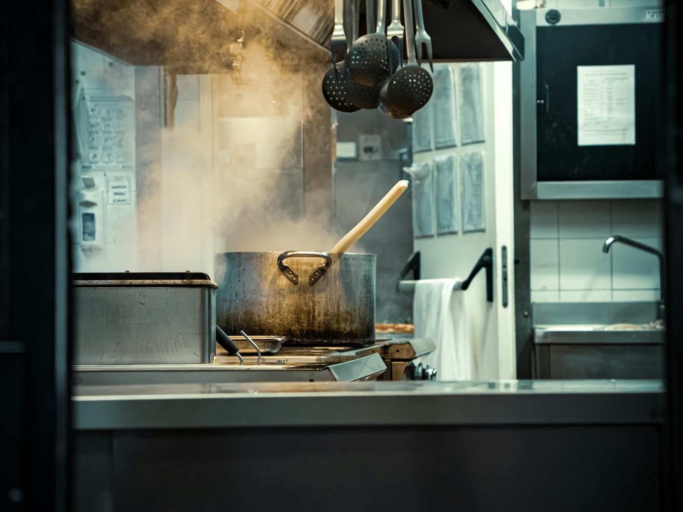 An institutional kitchen cooking at scale